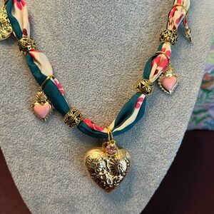 Gold Heart Boho Charm Necklace with Pink Accent on Teal & Cream Scarf
